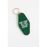 Green vintage hotel keychain with funny text Don’t Make Me Turn the Car Around