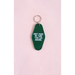 Green vintage hotel keychain with funny Don’t Make Me Turn This Car Around text