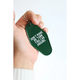 Green vintage hotel keychain tag with funny Don’t Make Me Look Around text