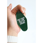 Green vintage hotel keychain tag with funny Don’t Make Me Turn This Car Around text