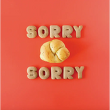 Sorry in cookie letters with a bread roll on red, from Céline Dijon’s polished prints