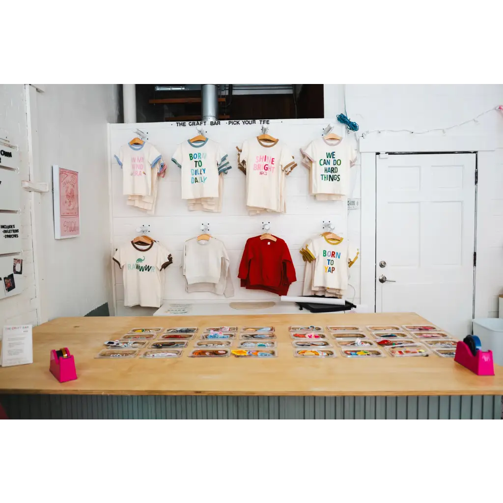Clothing display at Edwardsville Craft Bar showcasing stylish outfits for shoppers