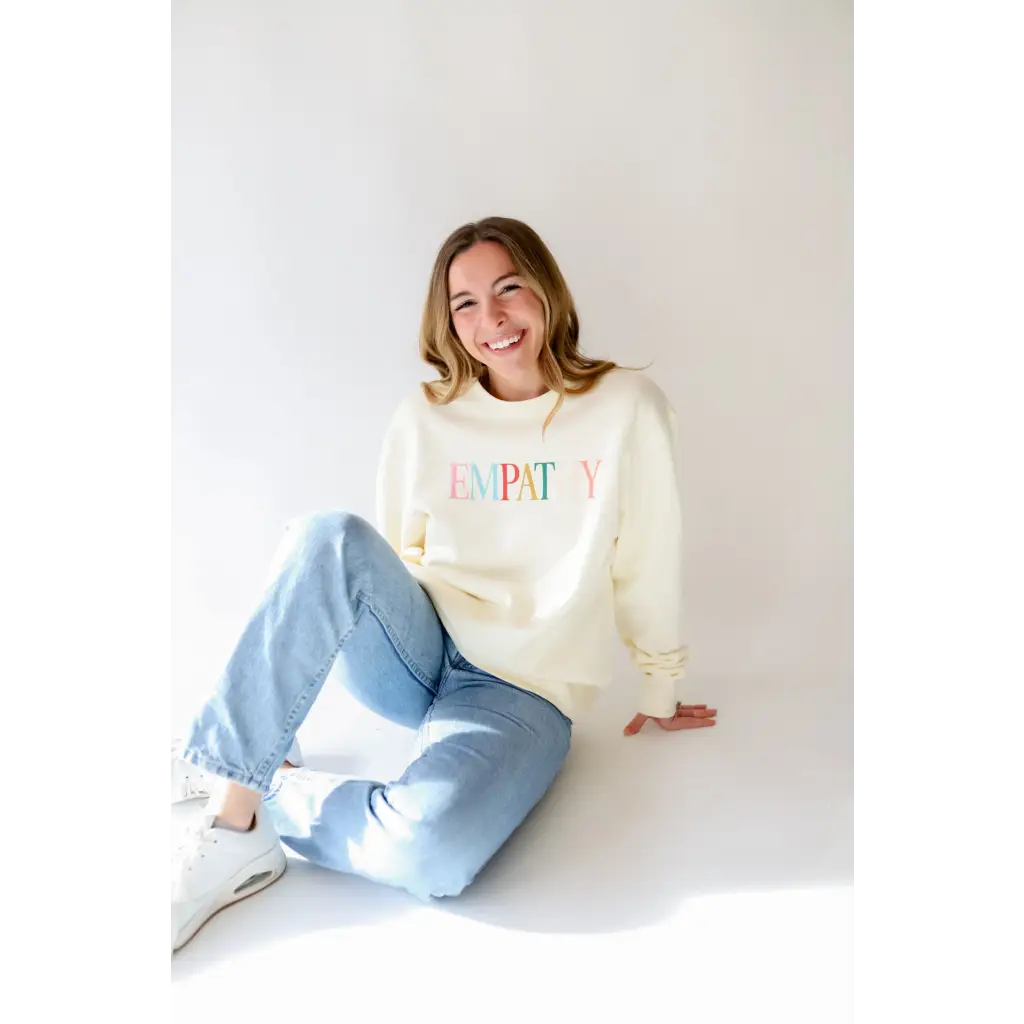 White Empathy Midweight Crewneck Sweatshirt with colorful HAPPY text design
