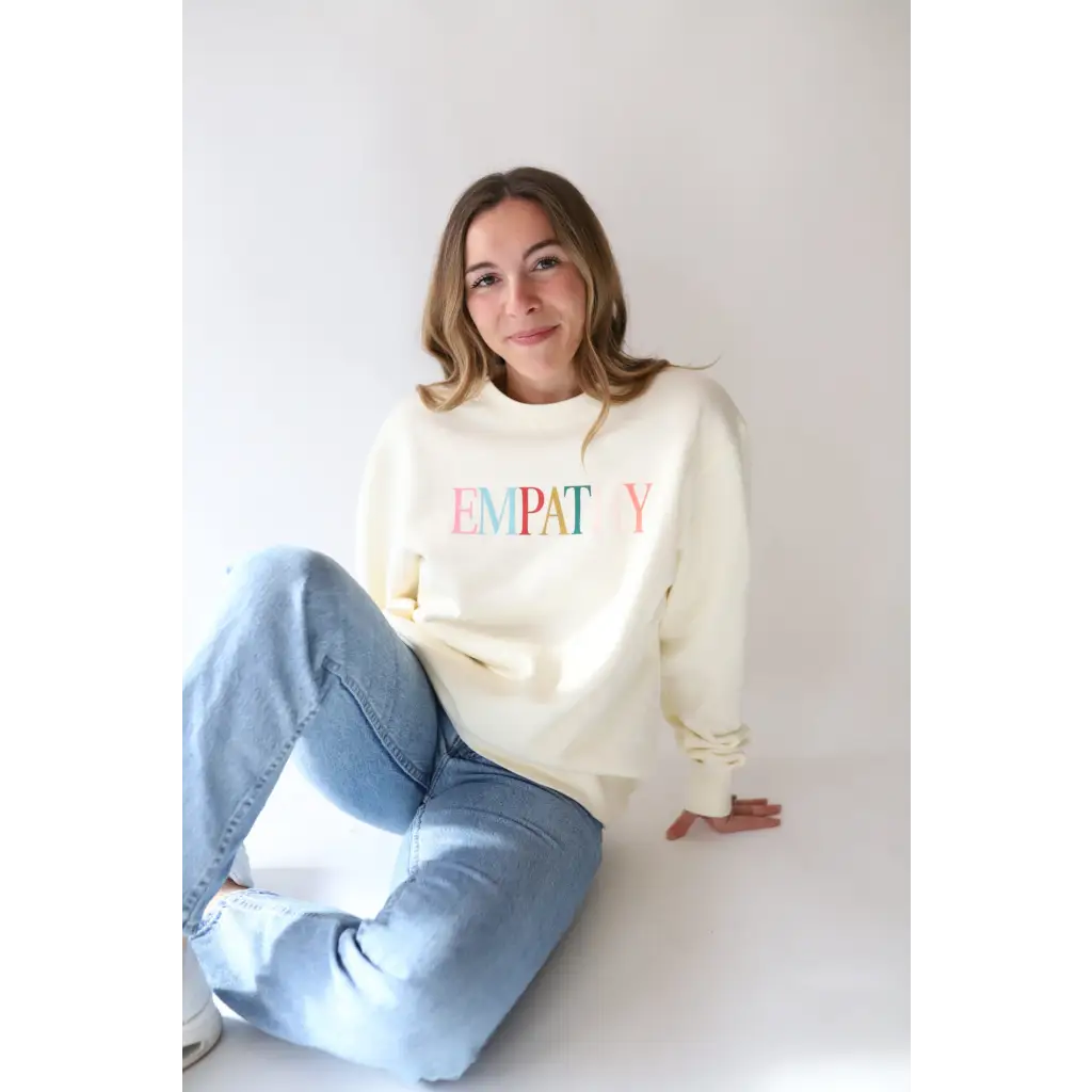 White Empathy Midweight Crewneck Sweatshirt with colorful text design front