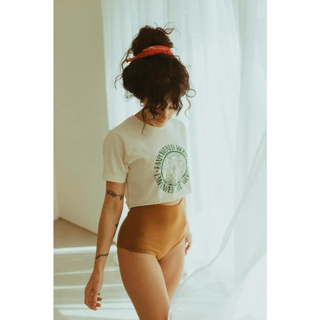 Person in Empowered Women Empower the World T-shirt by Polished Prints and high-waisted underwear