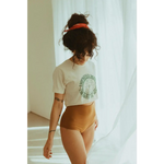Person in Empowered Women Empower the World T-shirt by Polished Prints and high-waisted underwear
