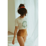 Person in Empowered Women Empower the World T-shirt by Polished Prints and high-waisted underwear