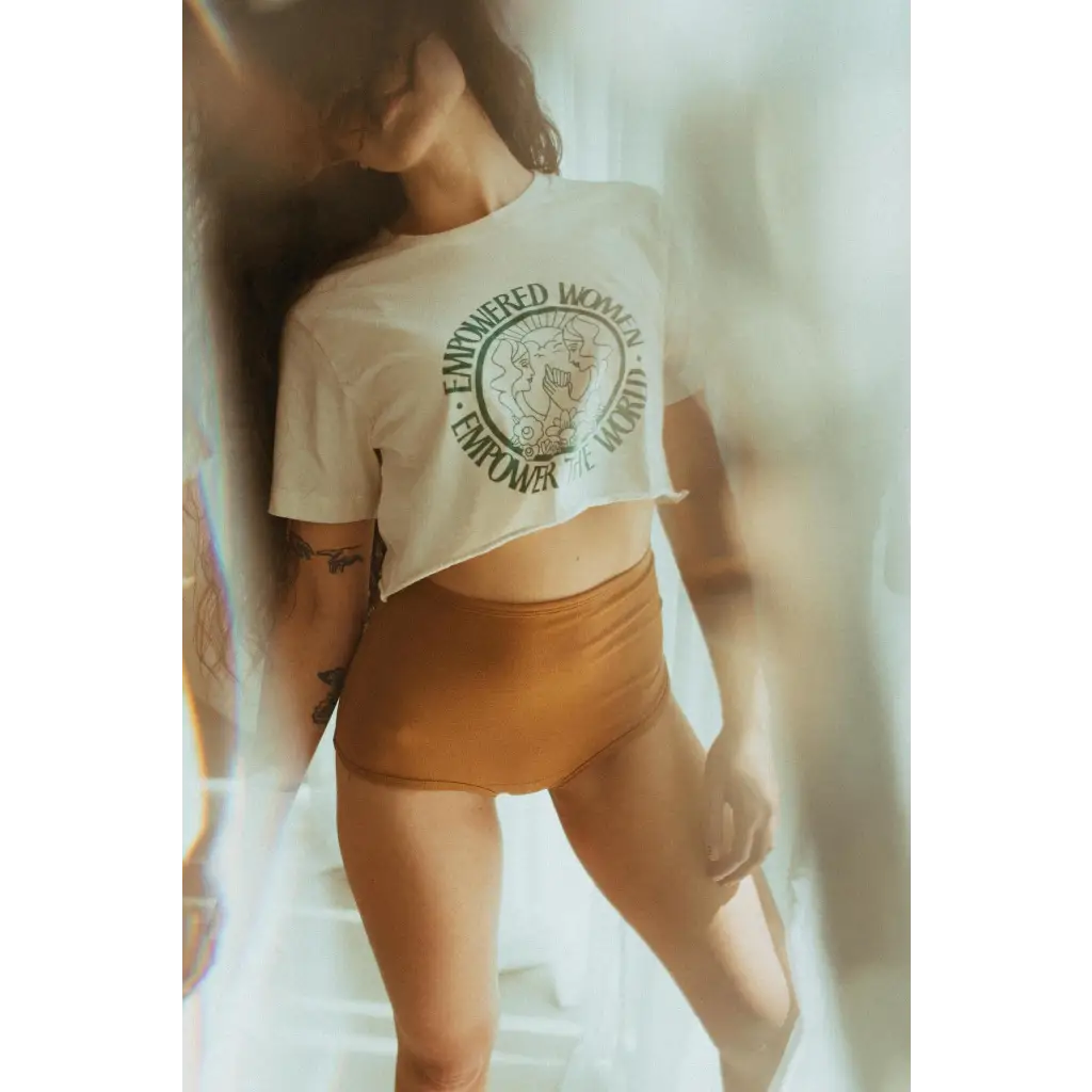White cropped t-shirt with circular medallion by Polished Prints promoting empowered women