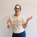 White t-shirt with pink text empowering women to dream and inspire with vision