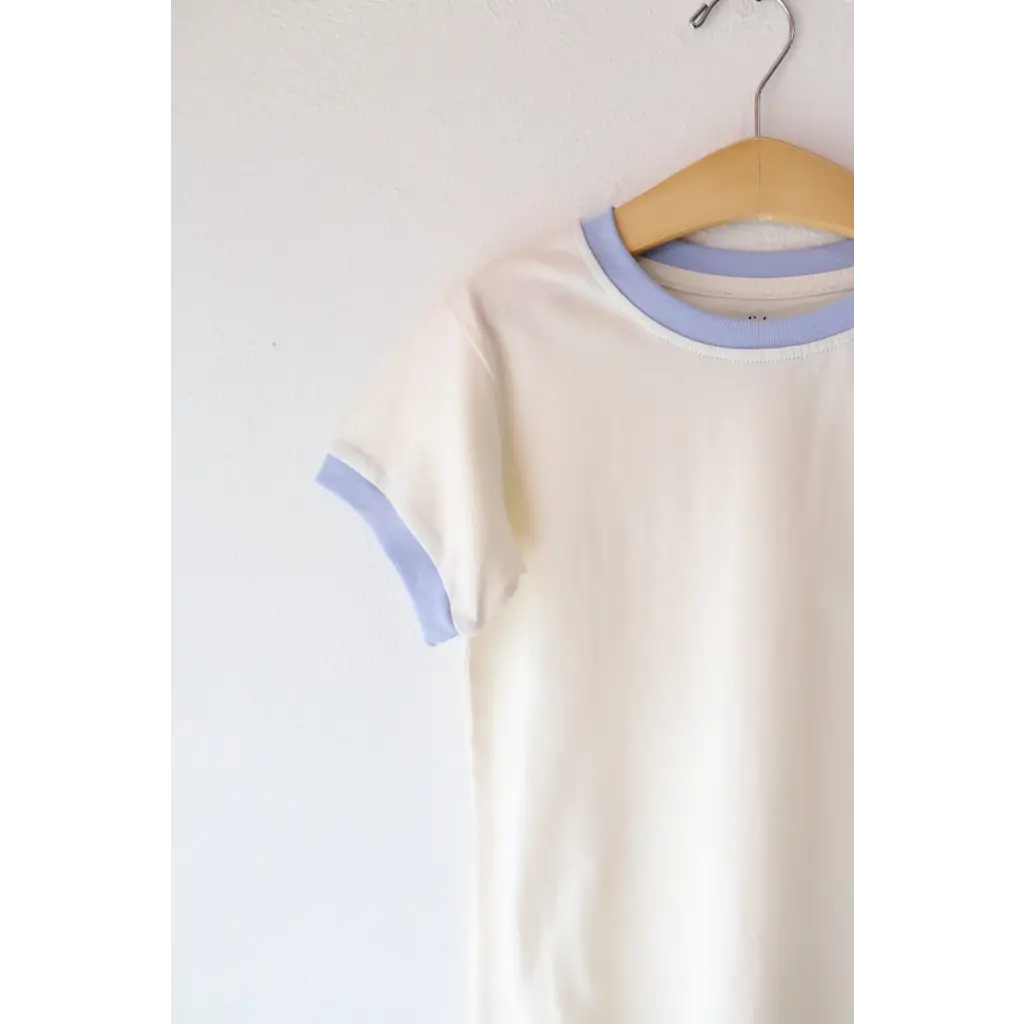 Cream Baby T-shirt with Light Blue Trim on Hanger, perfect everyday ringer tee