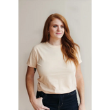 Woman in cream Sunkiss Unisex Adult Tee made from soft organic cotton
