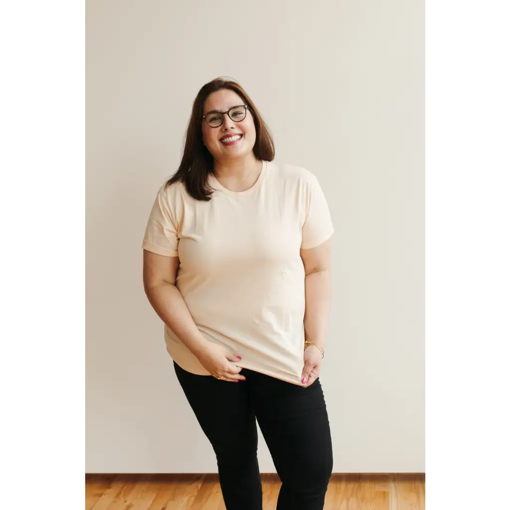 Smiling person in glasses wearing Sunkiss Unisex Adult Tee made of organic cotton