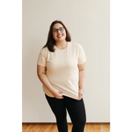 Smiling person in glasses wearing Sunkiss Unisex Adult Tee made of organic cotton