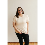 Smiling person in glasses wearing Sunkiss Unisex Adult Tee made of organic cotton