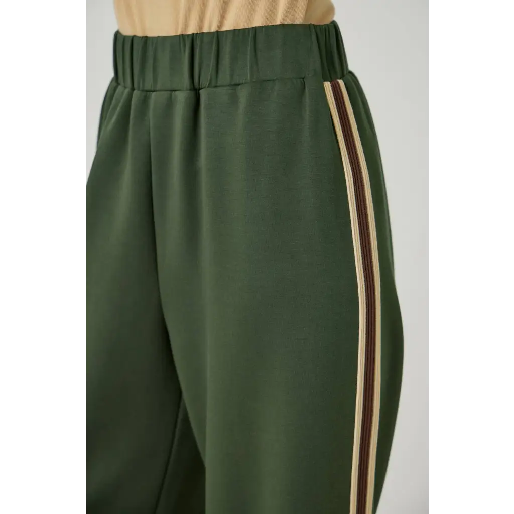 Olive green tracksuit pants with embroidered stripes and elastic waist for stylish womens clothes