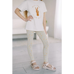 White t-shirt with peace sign, paired with good vibes lightweight leggings and sandals