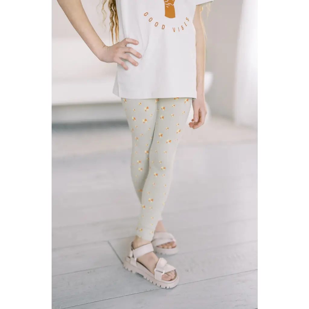 Light gray flexible lightweight leggings with yellow polka dots for good vibes