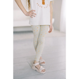 Light gray flexible lightweight leggings with yellow polka dots for good vibes