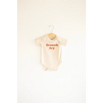 Cream-colored organic cotton baby onesie with french fry text, 3mo fits closer