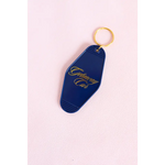 Navy blue vintage motel key tag with gold lettering for your getaway car vibes