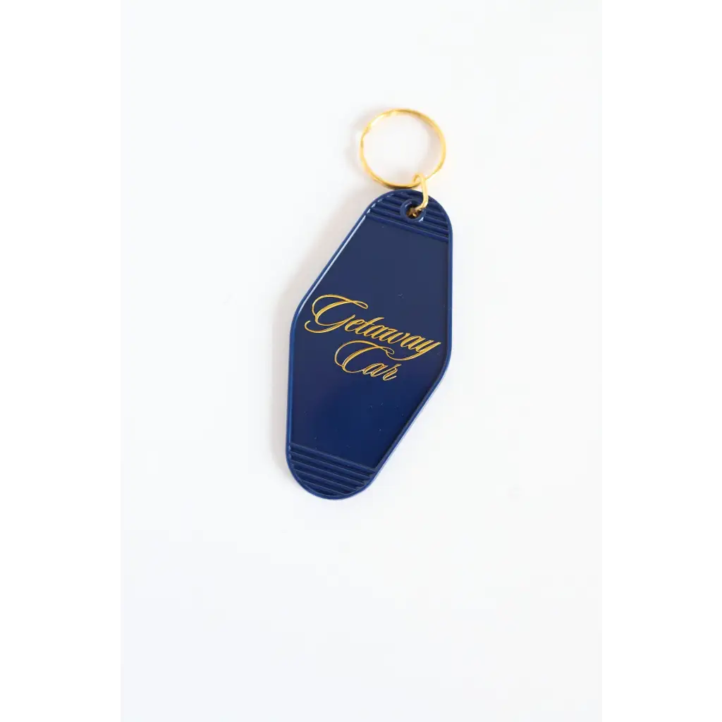Navy blue vintage motel key tag with gold lettering for your Getaway Car vibe