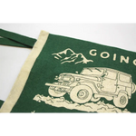Green home pennant with John Muir design and off-road vehicle in a mountain setting