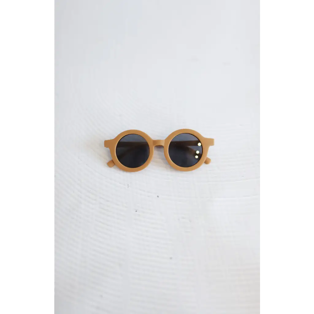 Round wooden sunglasses with dark lenses from the Super Cool Golden Brown Sunnies collection