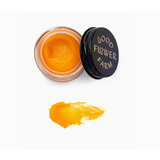 Open jar of Golden Glow Beauty Balm 1 oz for polished prints and stylish womens clothes