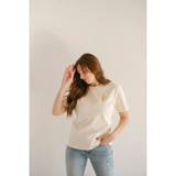White Vibes Peace Embroidered Tee featuring a small yellow detail for good vibes peace