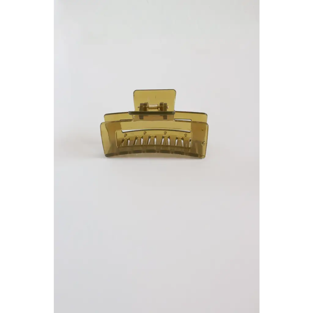 Translucent yellow medium size hair clip with ridged teeth, a favorite go-to hair accessory
