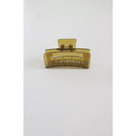 Translucent yellow medium size hair clip with ridged teeth, a favorite go-to hair accessory