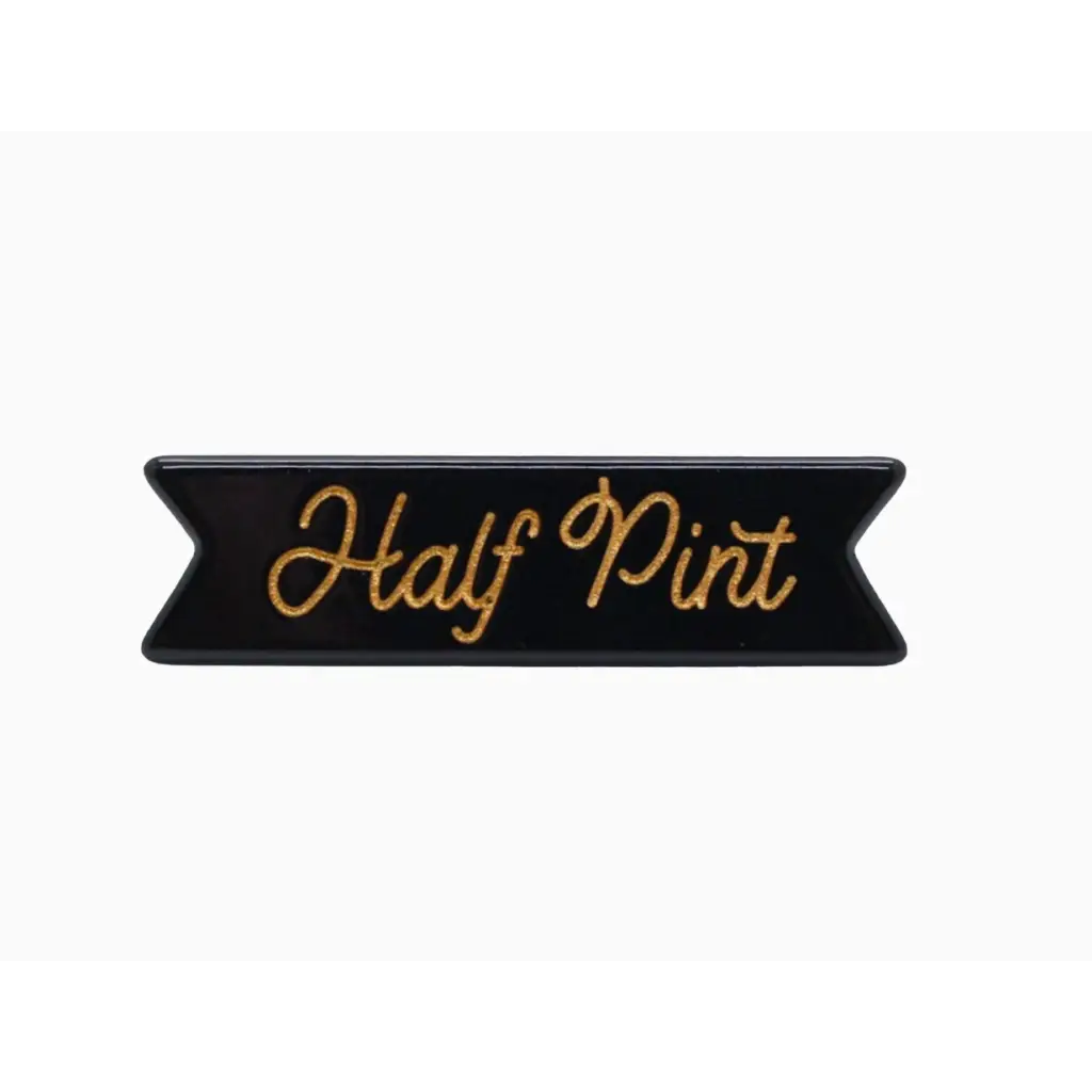Black banner patch with Half Pint in gold script on a chic Half Pint hair clip