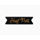 Black banner patch with Half Pint in gold script on a chic Half Pint hair clip