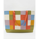 Colorful patchwork tote bag with orange straps and interior slip pocket for storage