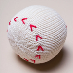 White knitted baseball rattle with red stitching for your little all-star from Estella Organic