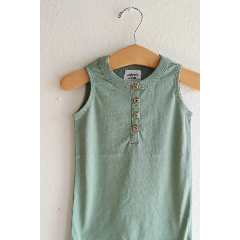 Mint green sleeveless henley romper on a wooden hanger, made of super soft organic cotton