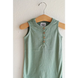 Mint green sleeveless henley romper on a wooden hanger, made of super soft organic cotton