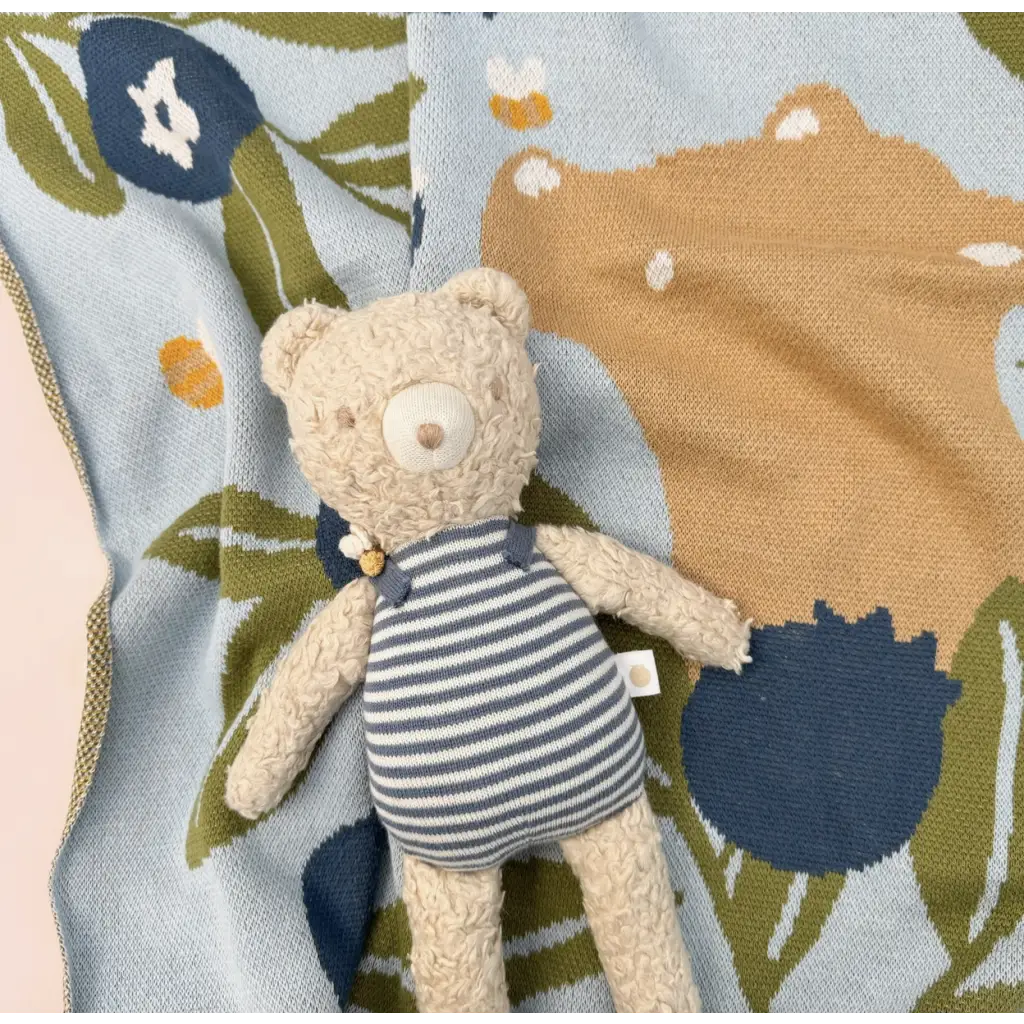 Plush Henry Bear in a striped dress loves spending time with friends in his cozy sweater