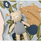 Plush Henry Bear in a striped dress loves spending time with friends in his cozy sweater
