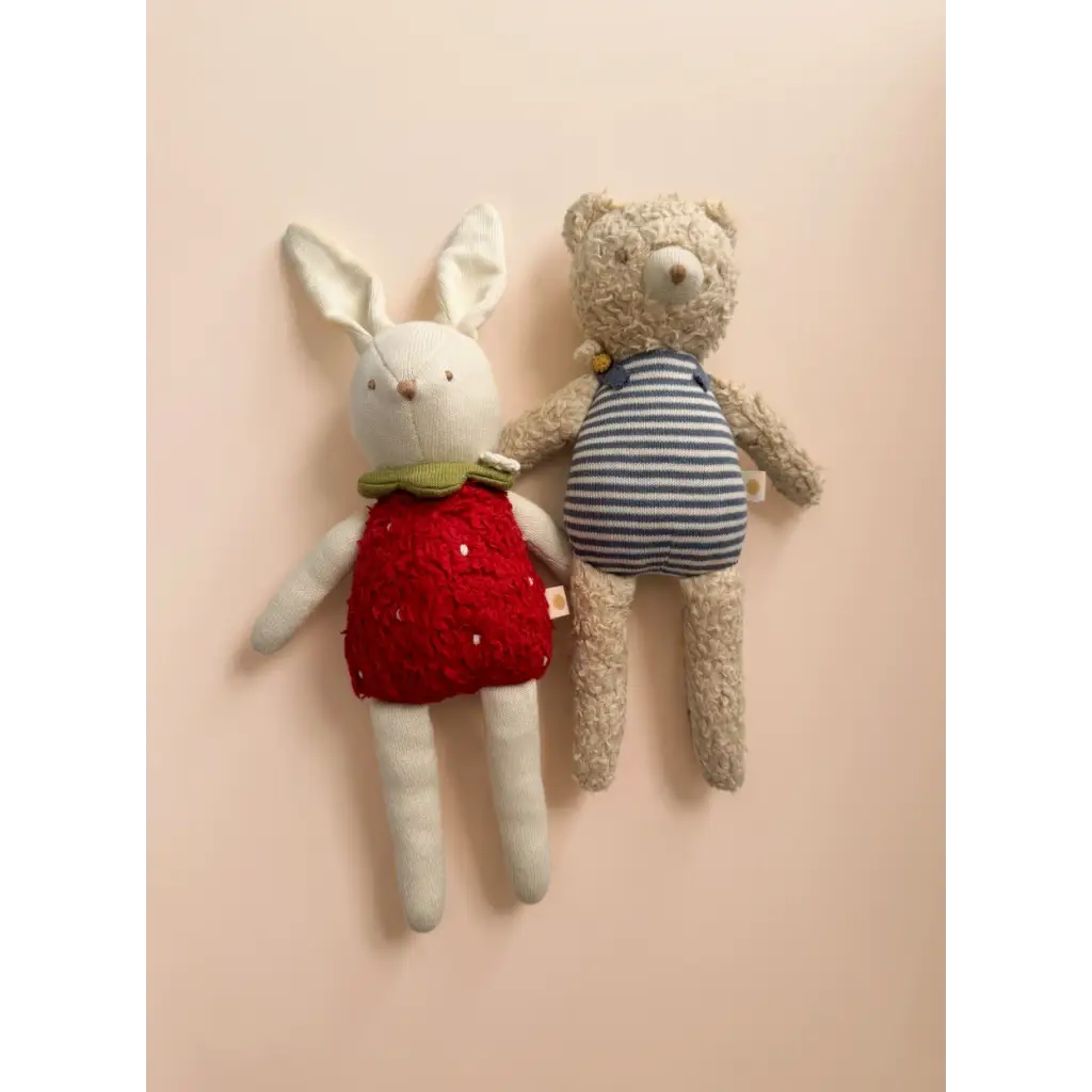 Two plush toys featuring Henry Bear and a cute bunny in cozy outfits