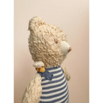 Cream-colored Henry Bear in a cozy blue and white striped sweater with a bow