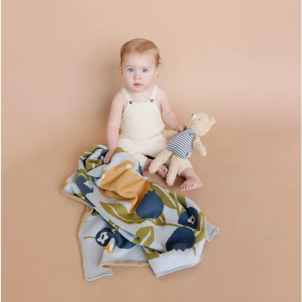 White cotton overalls with a floral blanket and stuffed toy perfect for Henry Bear loves spending time