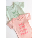 Mint Green and Pink Organic Cotton Baby Onesies saying hi, I’m new here