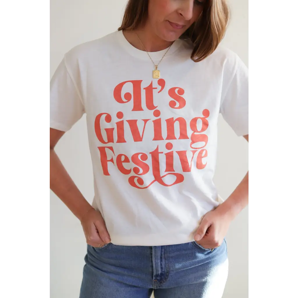 Giving Festive Unisex T-shirt with Coral Text showcasing a fun festive style