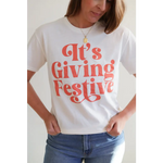 Giving Festive Unisex T-shirt with Coral Text showcasing a fun festive style