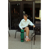 Green cylindrical bollard for styling your Kate Fleece Pullover in every gal’s wardrobe