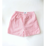 Kids striped pull-on shorts in pink and white with classic nautical style and seersucker-textured fabric