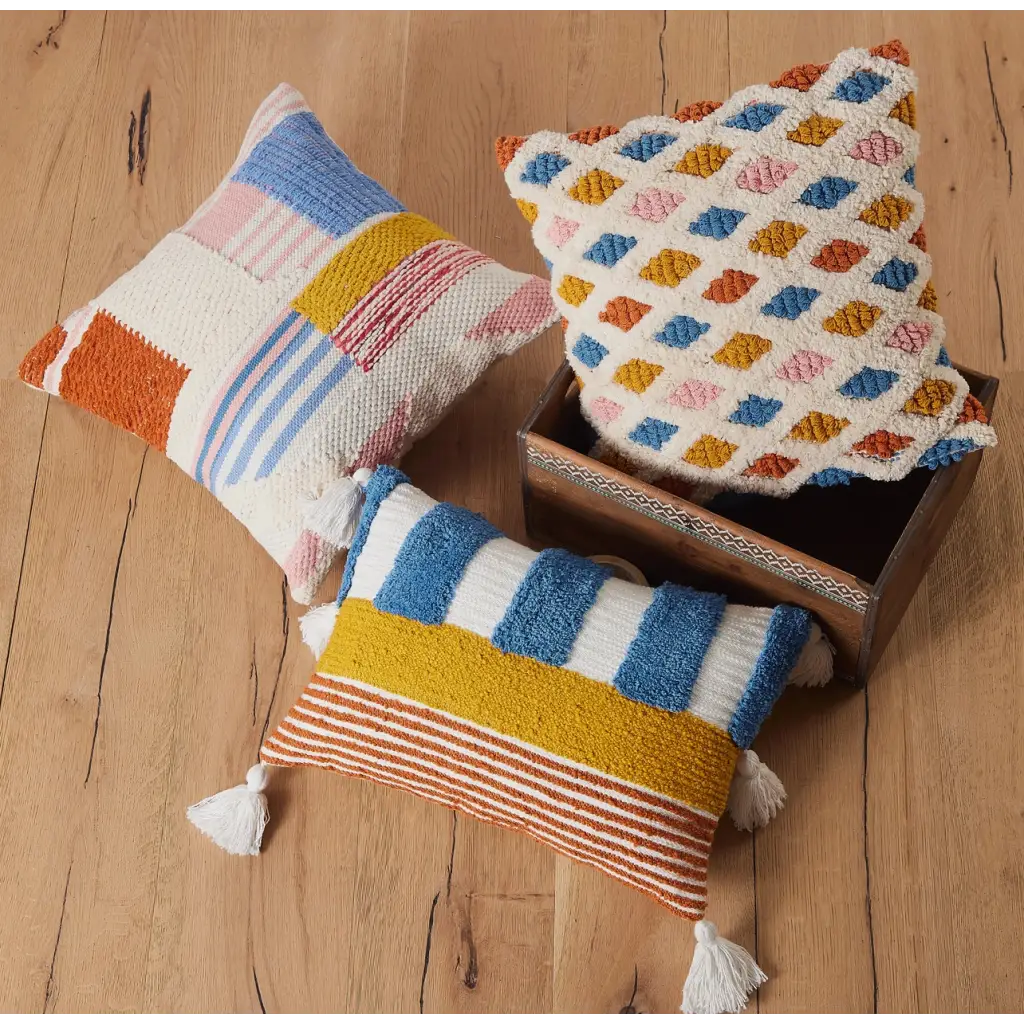 Colorful Lana Decorative Pillow featuring a geometric diamond pattern and cute tassels