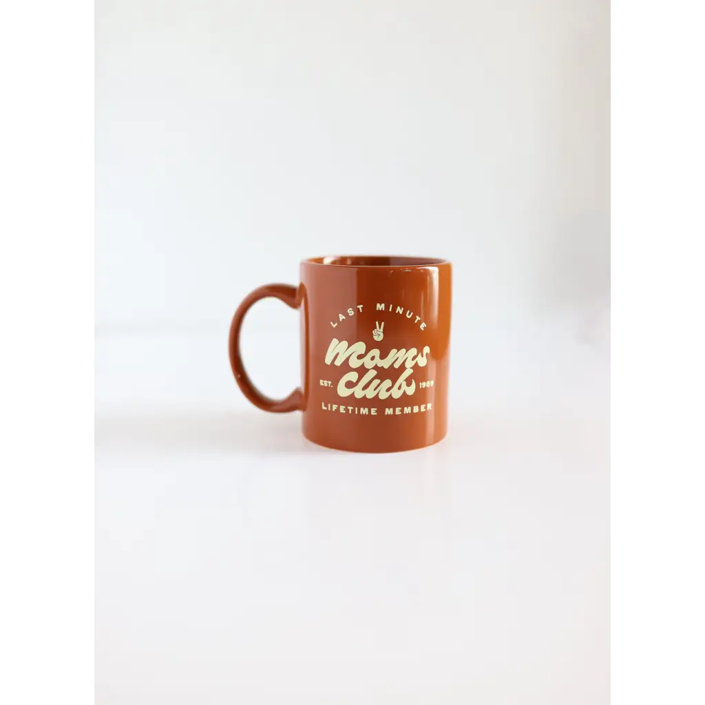 Terracotta ceramic mug for Minute Moms Club featuring fun Moms Club text