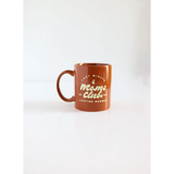 Terracotta ceramic mug for Minute Moms Club featuring fun Moms Club text